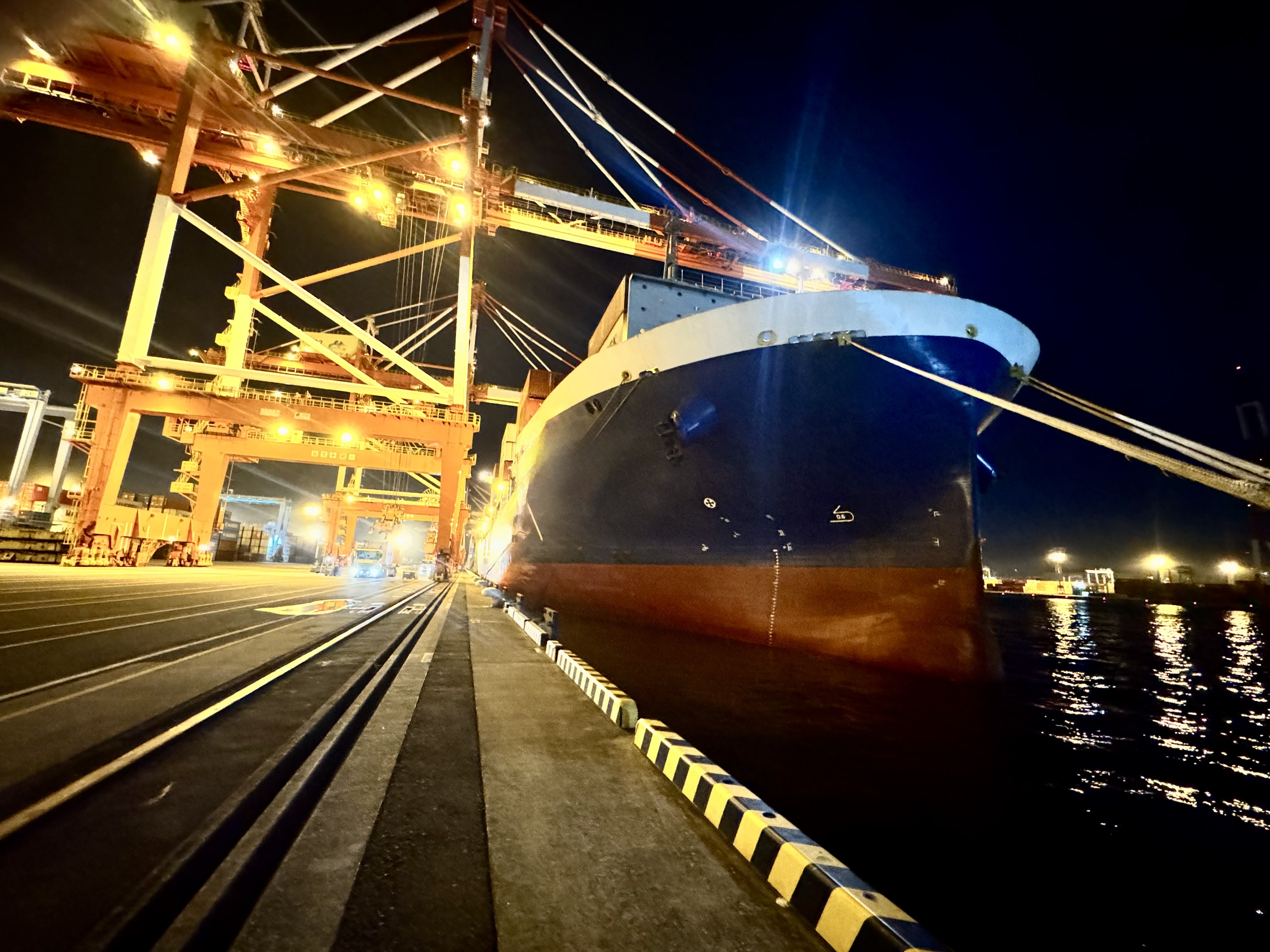 Container ship at night port